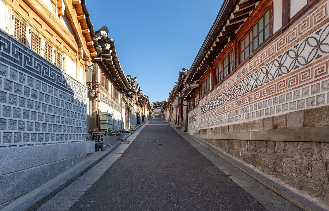 Traditional hanok houses on a street in Bukchon Hanok Village, Seoul