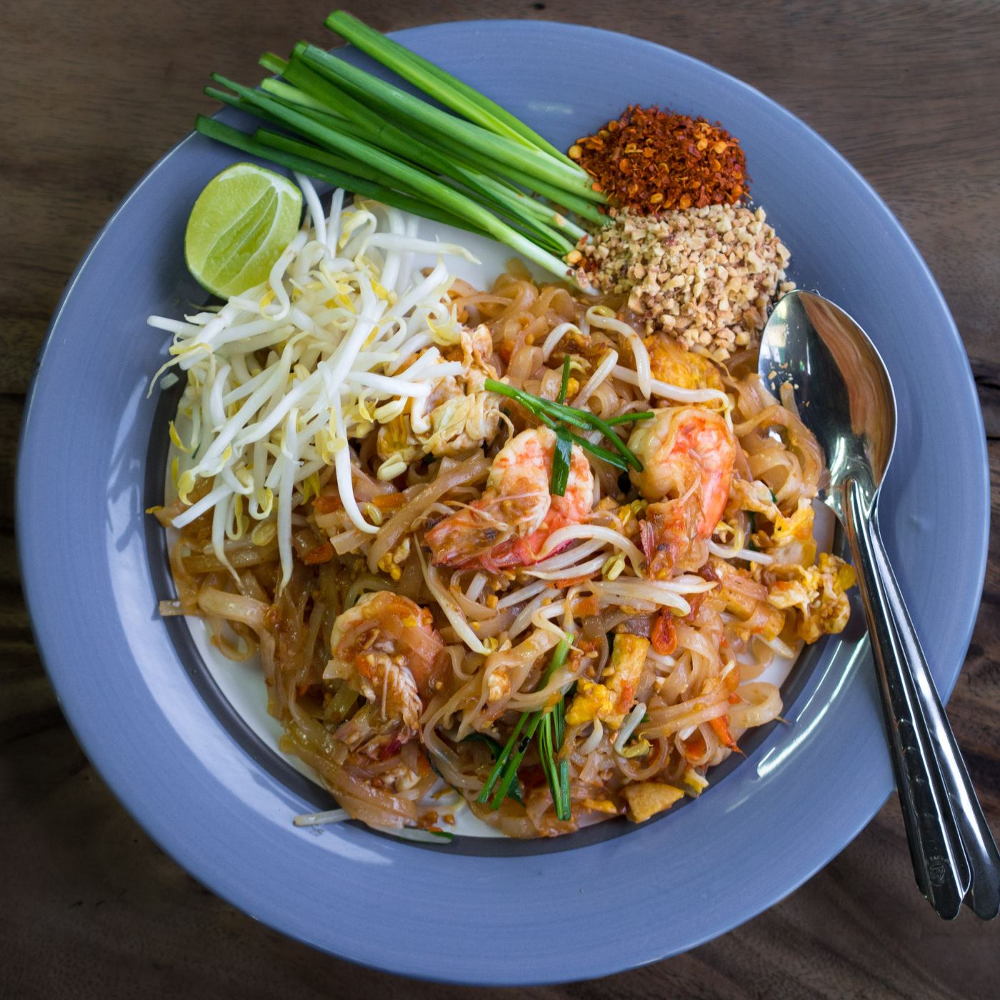 Pad Thai noodles served with shrimp at a street stall