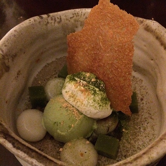 A layered matcha parfait with red bean and cream