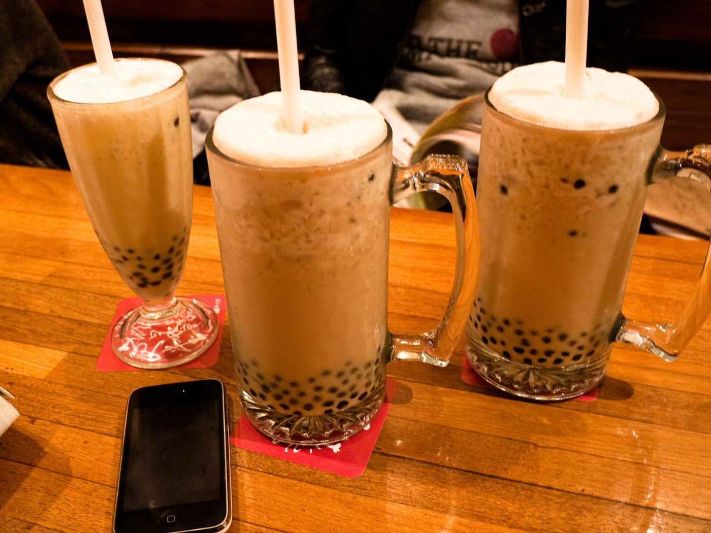 Cups of Taiwanese bubble tea with tapioca pearls