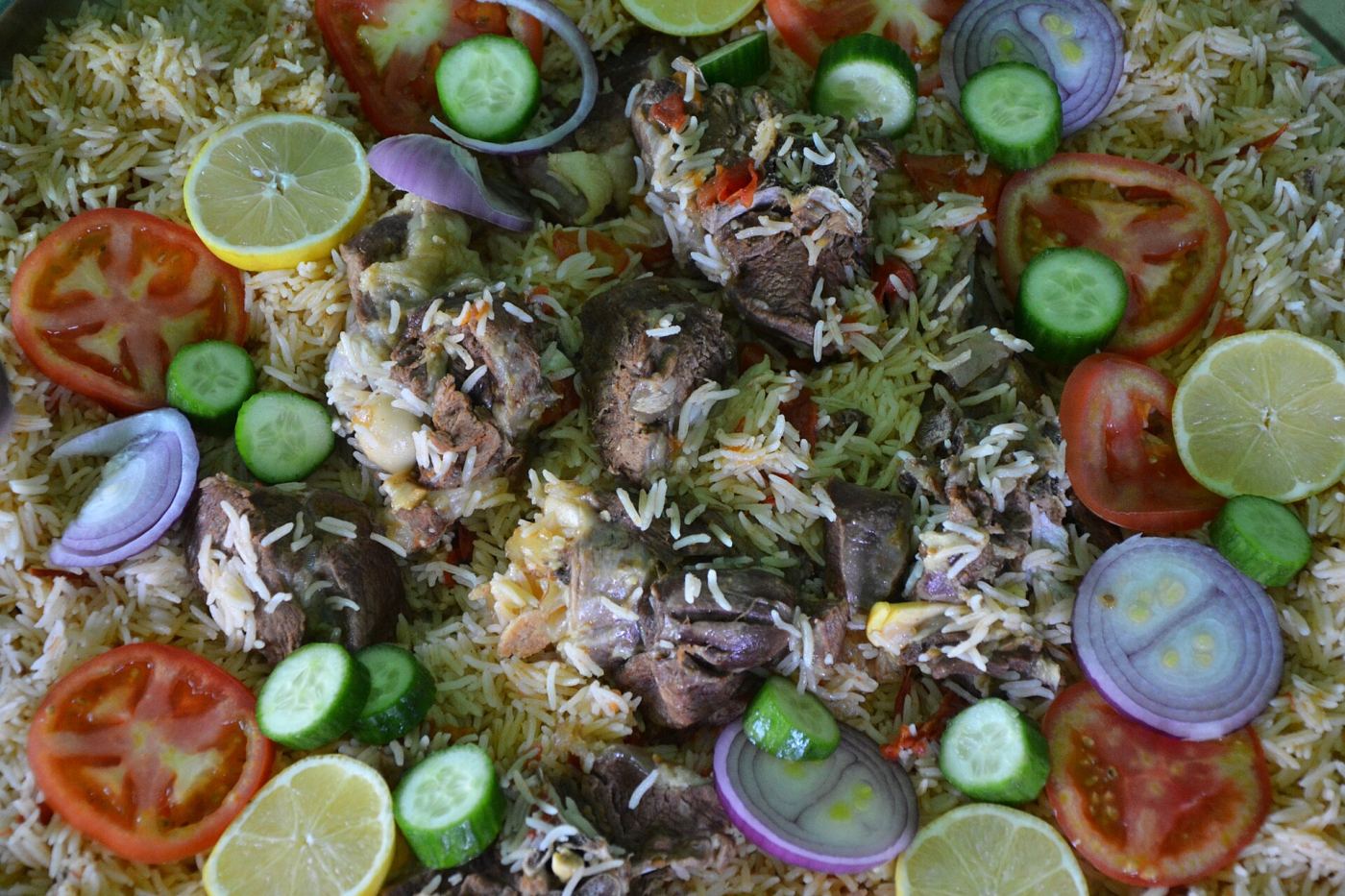 A platter of spiced Gulf rice with meat, in the style of machboos and kabsa