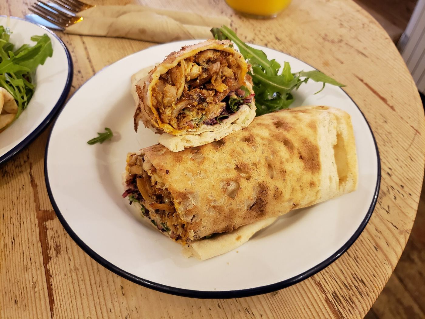 A shawarma wrap sliced from a vertical spit