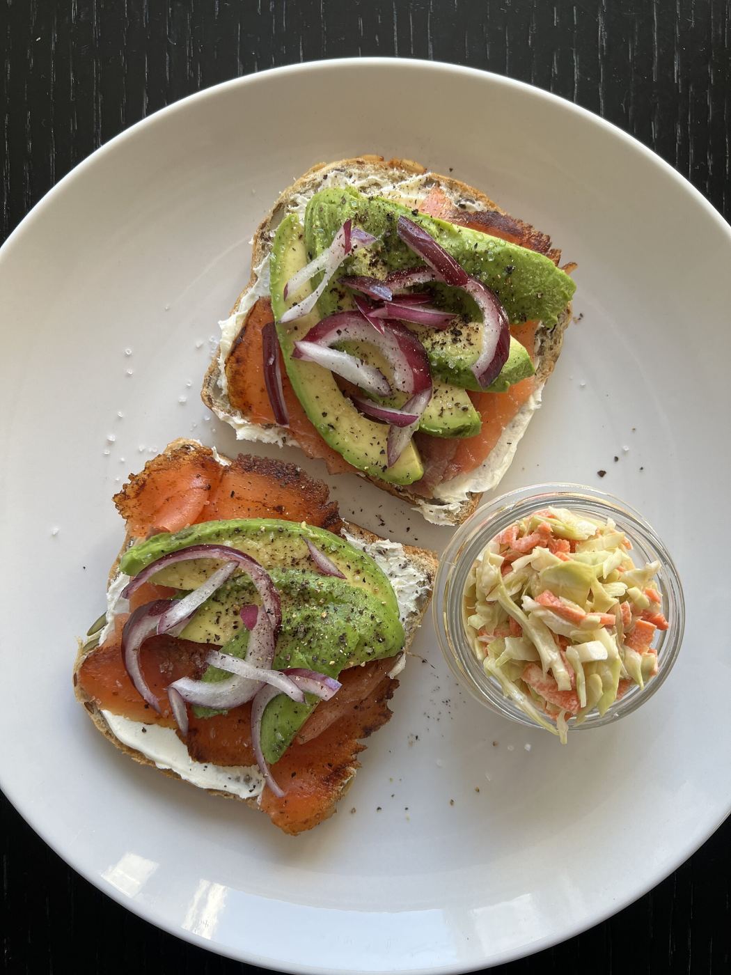 An open sandwich topped with smoked salmon