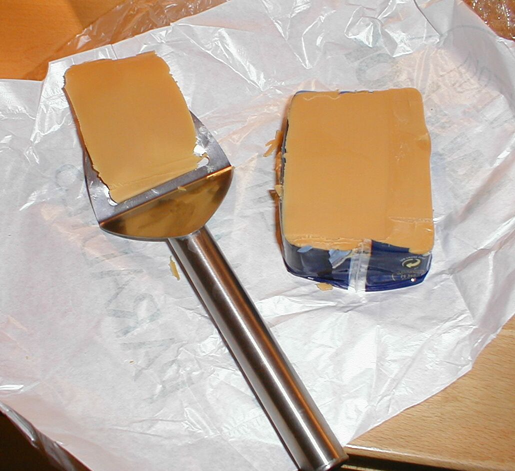 A block of Norwegian brunost brown cheese
