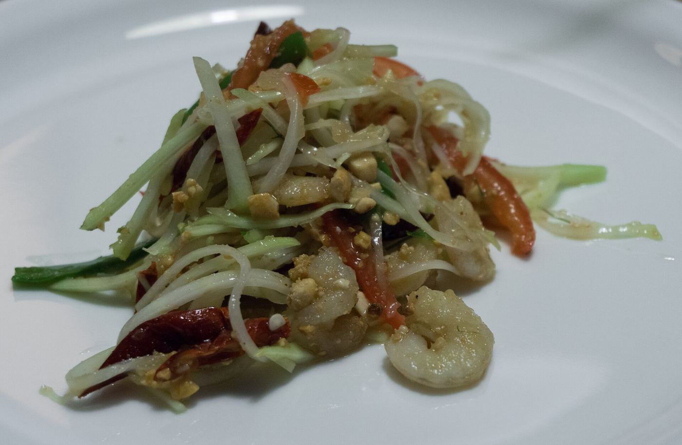 Fresh som tam papaya salad being prepared