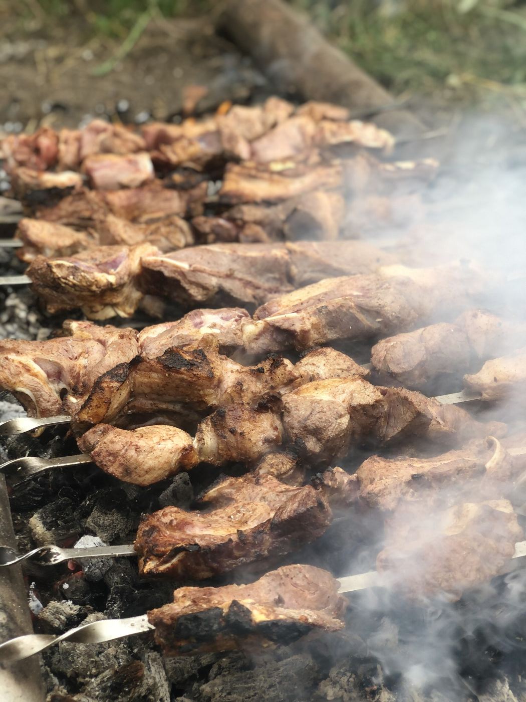 Khorovats being grilled over charcoal