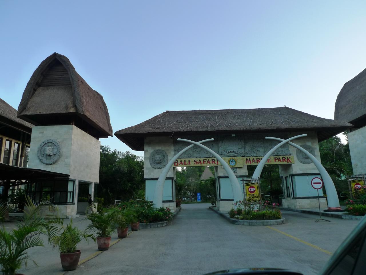 Entrance gate to Bali Safari and Marine Park with traditional thatched roofing