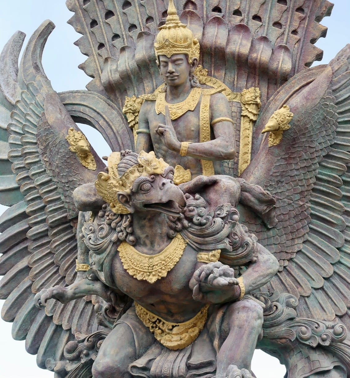 Close-up of the golden Garuda Wisnu Kencana statue depicting Vishnu riding the mythical bird Garuda