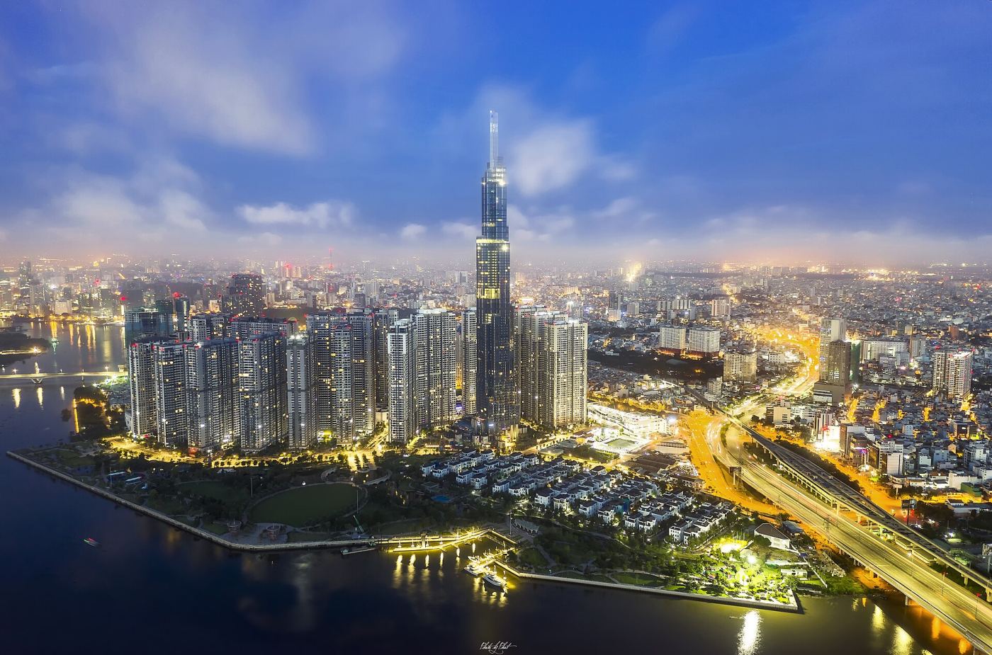 Landmark 81 skyscraper lit up at night above the Ho Chi Minh City skyline