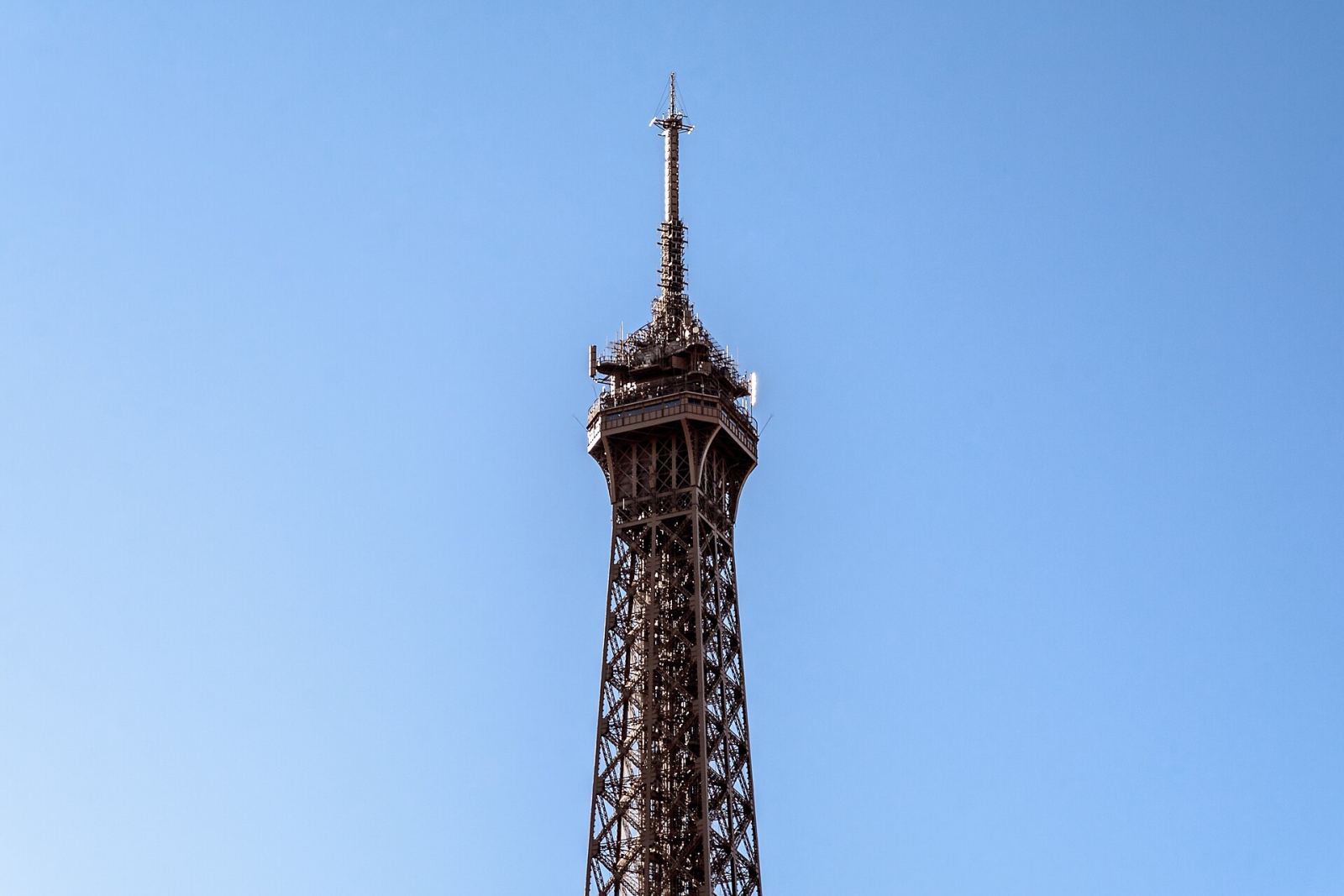 The Eiffel Tower rising against a clear blue sky in Paris