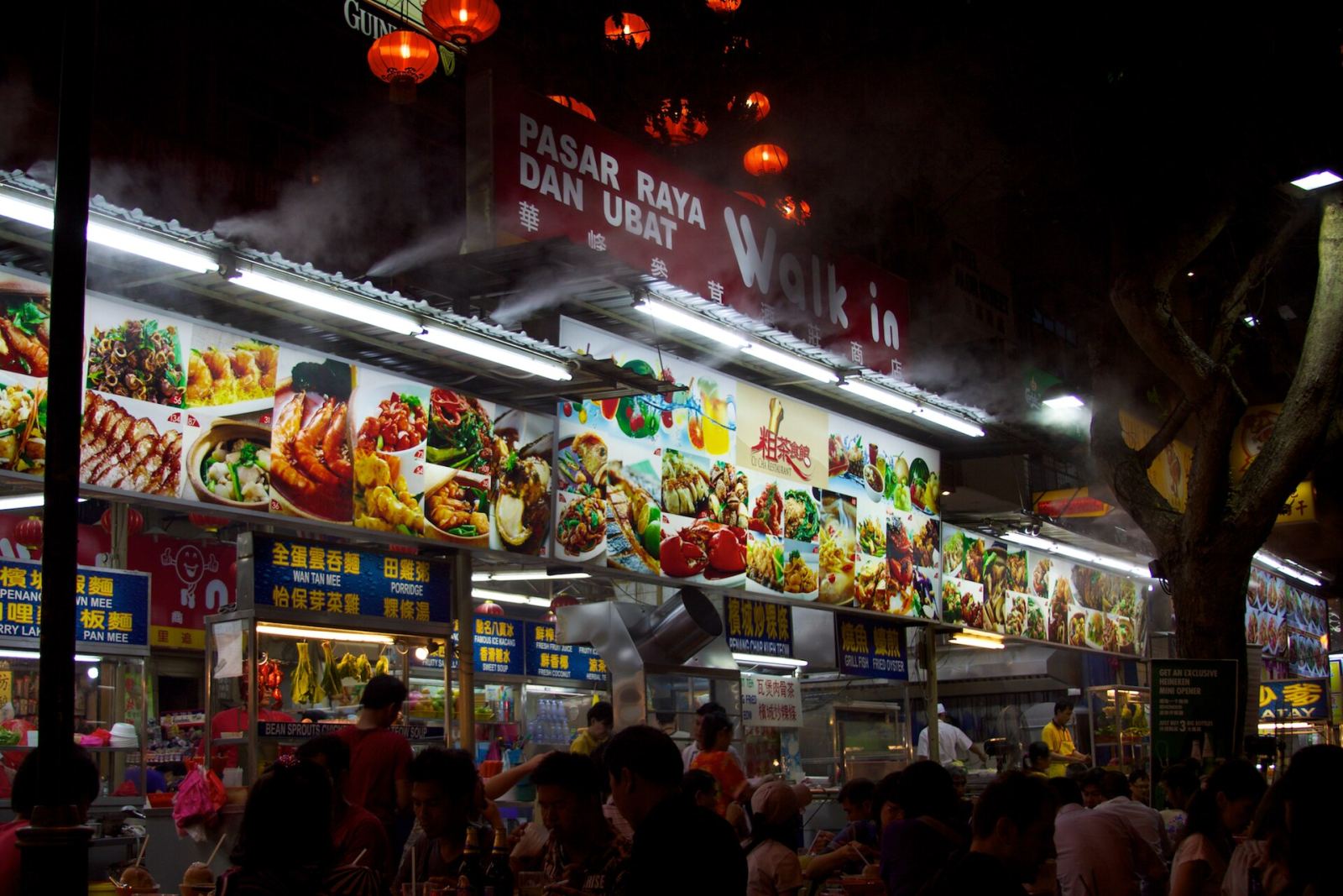 Restaurant menu signboard with food photos on Jalan Alor, Kuala Lumpur