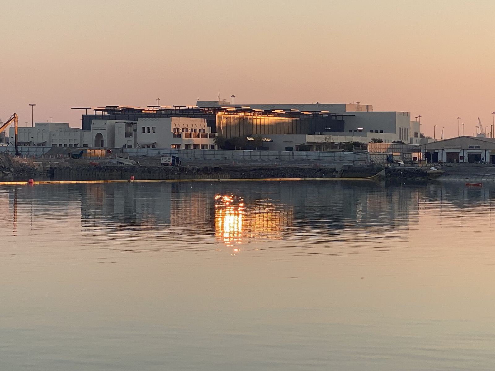 Waterfront building at dusk near Al Mina, Abu Dhabi