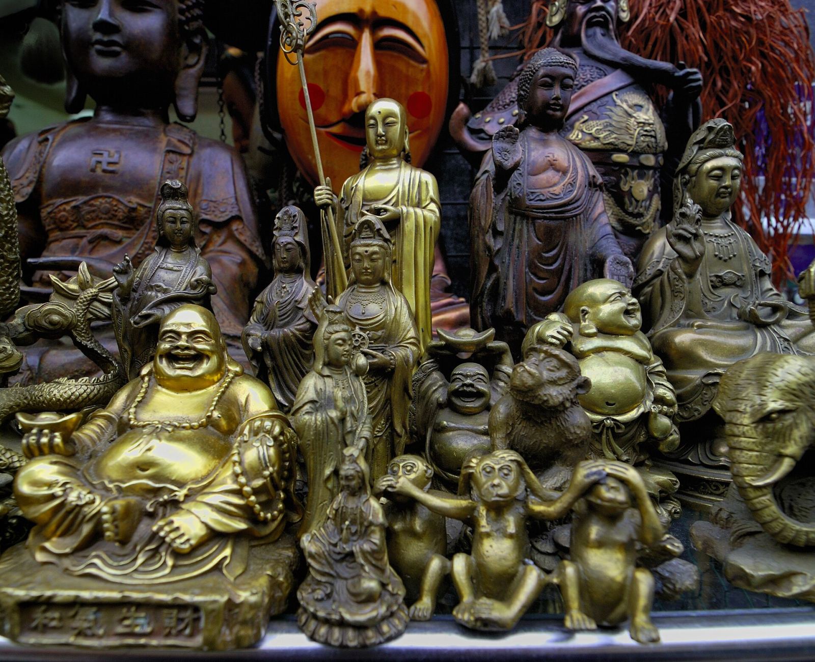 Antique shop display of brass Buddha statues in Insadong, Seoul